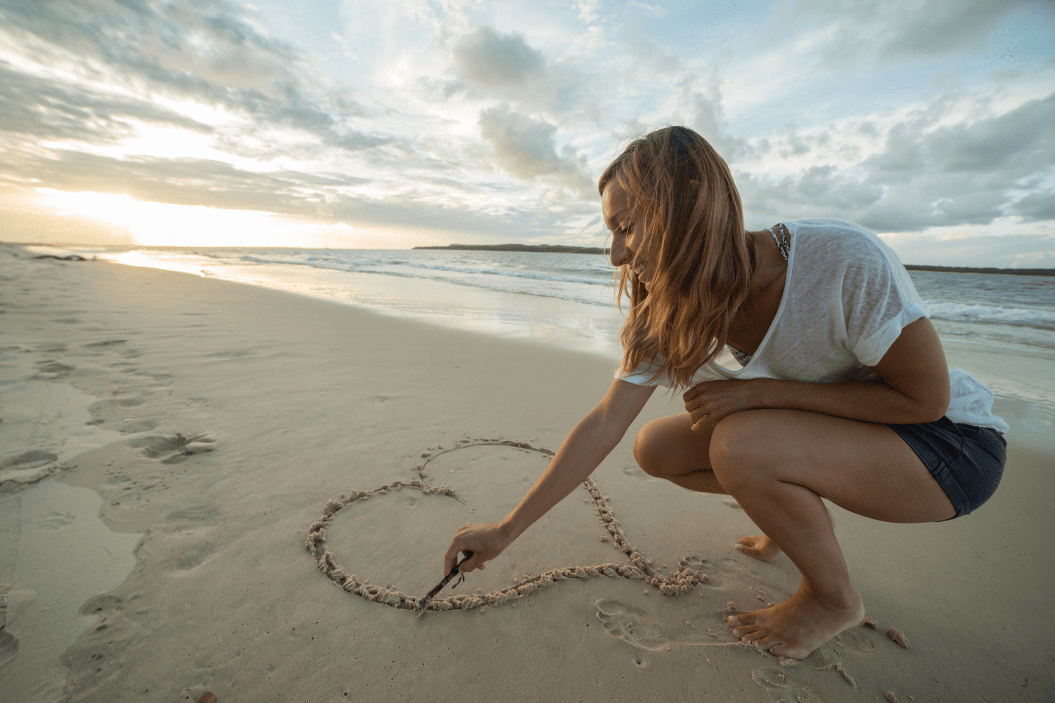 Beach Heart Midlife + Woman + Drawing Heart in Sand + Beach